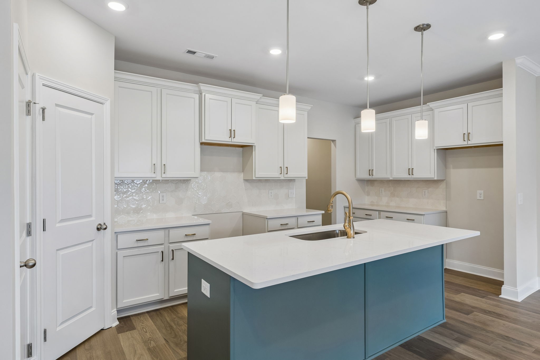 3215 Tasker Drive Antioch, TN 37013 - Photo 16 of 53 a kitchen with a sink a stove a refrigerator and white cabinets