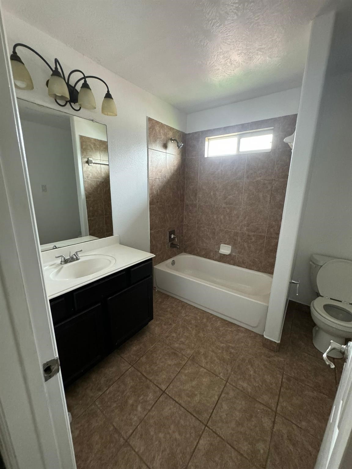 25614 Crisp Spring Lane Spring, TX 77373 - Photo 14 of 25 a bathroom with a bathtub sink mirror vanity and toilet