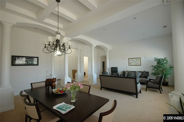 6983 Peacepipe Court Reno, NV 89511 - Photo 2 of 7 a view of a dining room with furniture and chandelier
