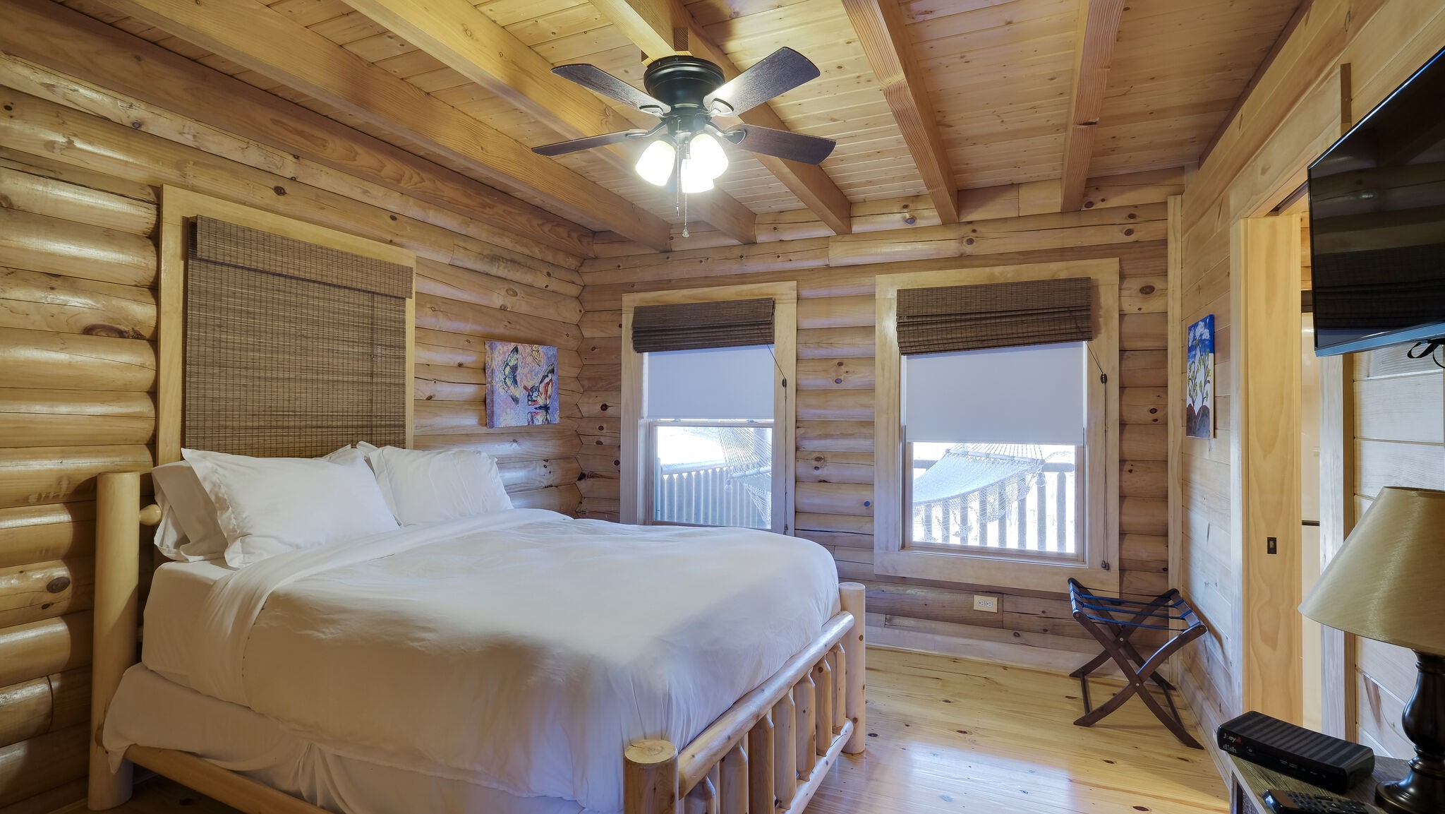 4054 Wilson Pike Franklin, TN 37067 - Photo 16 of 37 a bedroom with a large bed a flat tv screen and a dresser