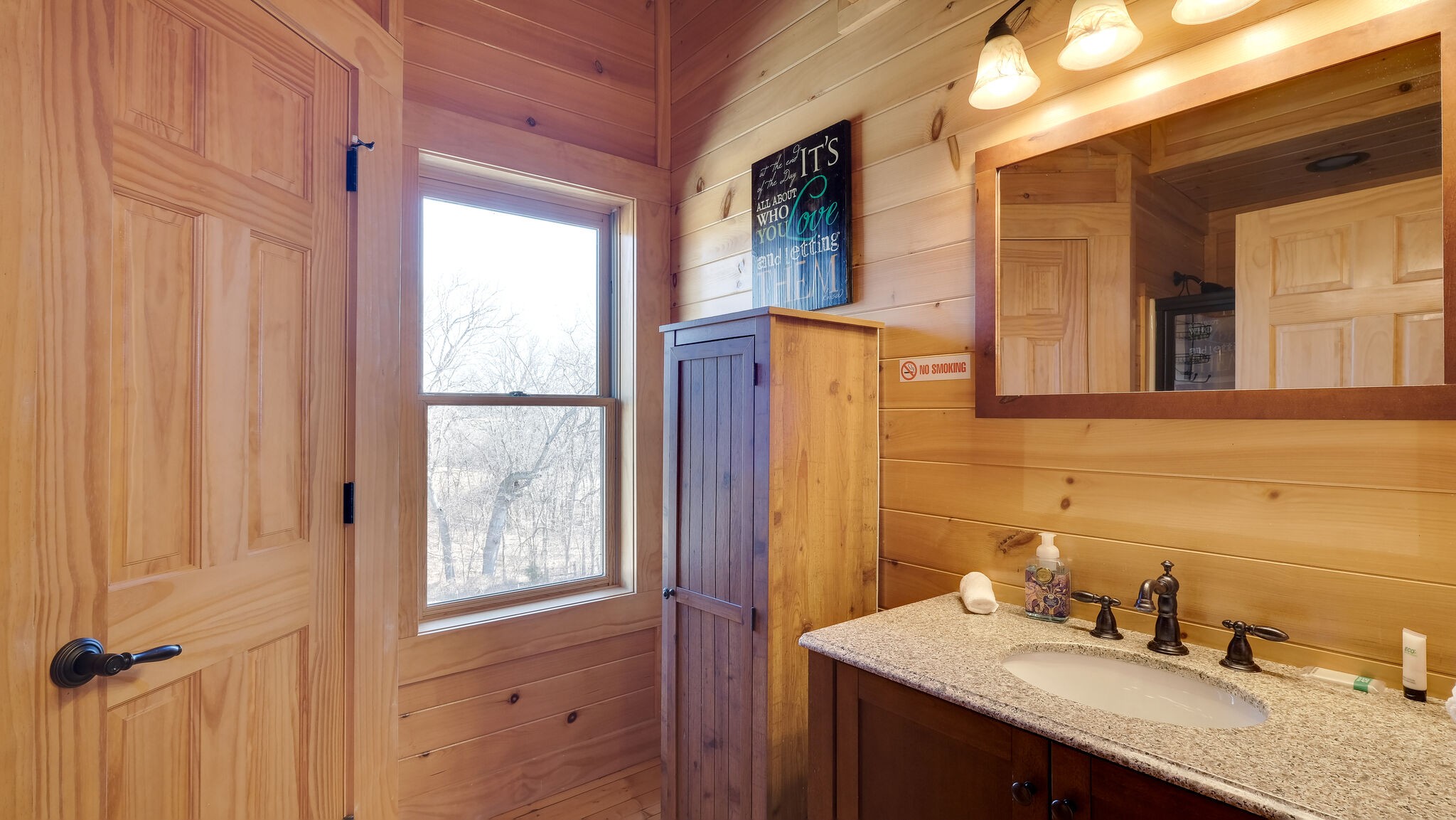 4054 Wilson Pike Franklin, TN 37067 - Photo 24 of 37 a bathroom with a granite countertop sink a mirror and a shower