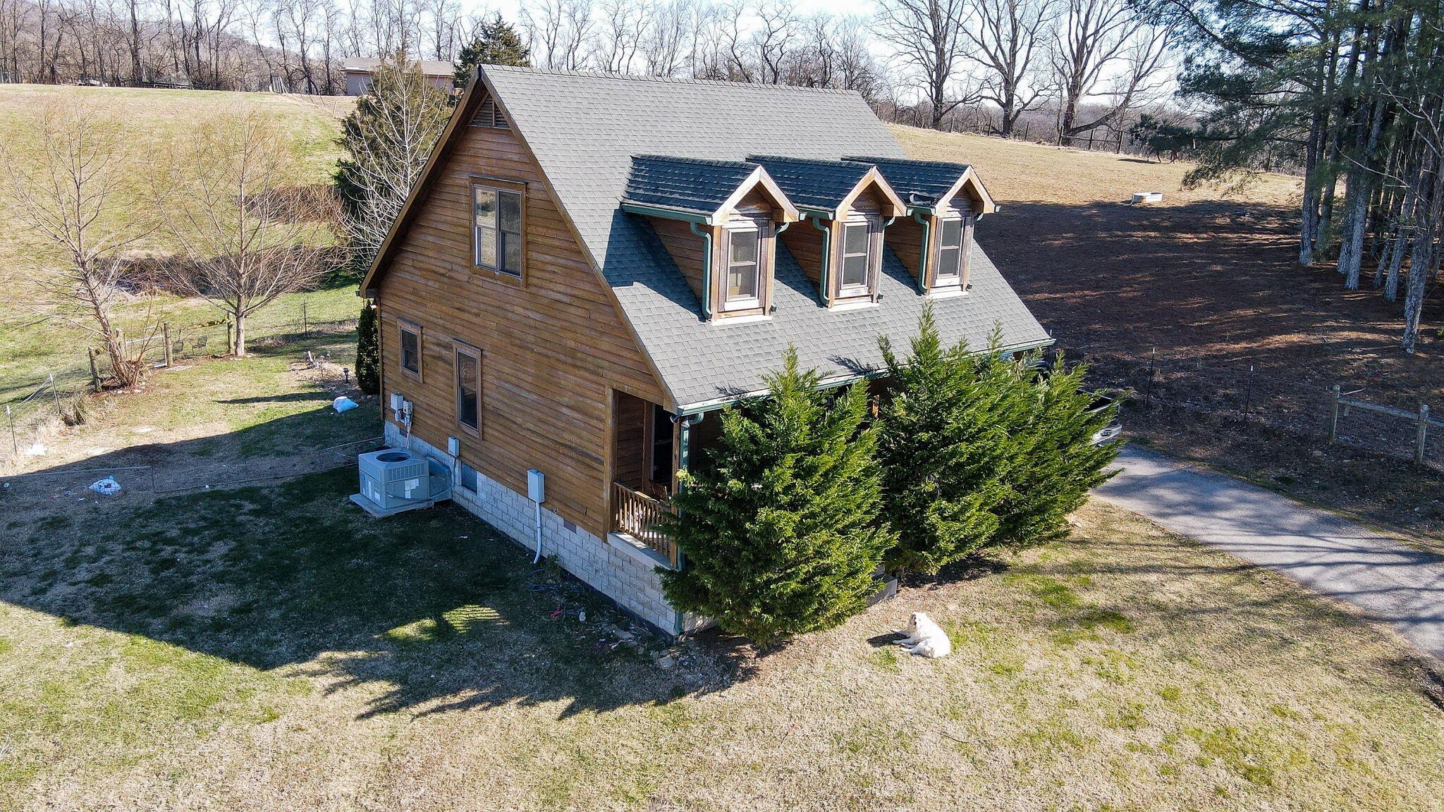 4054 Wilson Pike Franklin, TN 37067 - Photo 3 of 37 a view of a yard with brick wall and a large tree