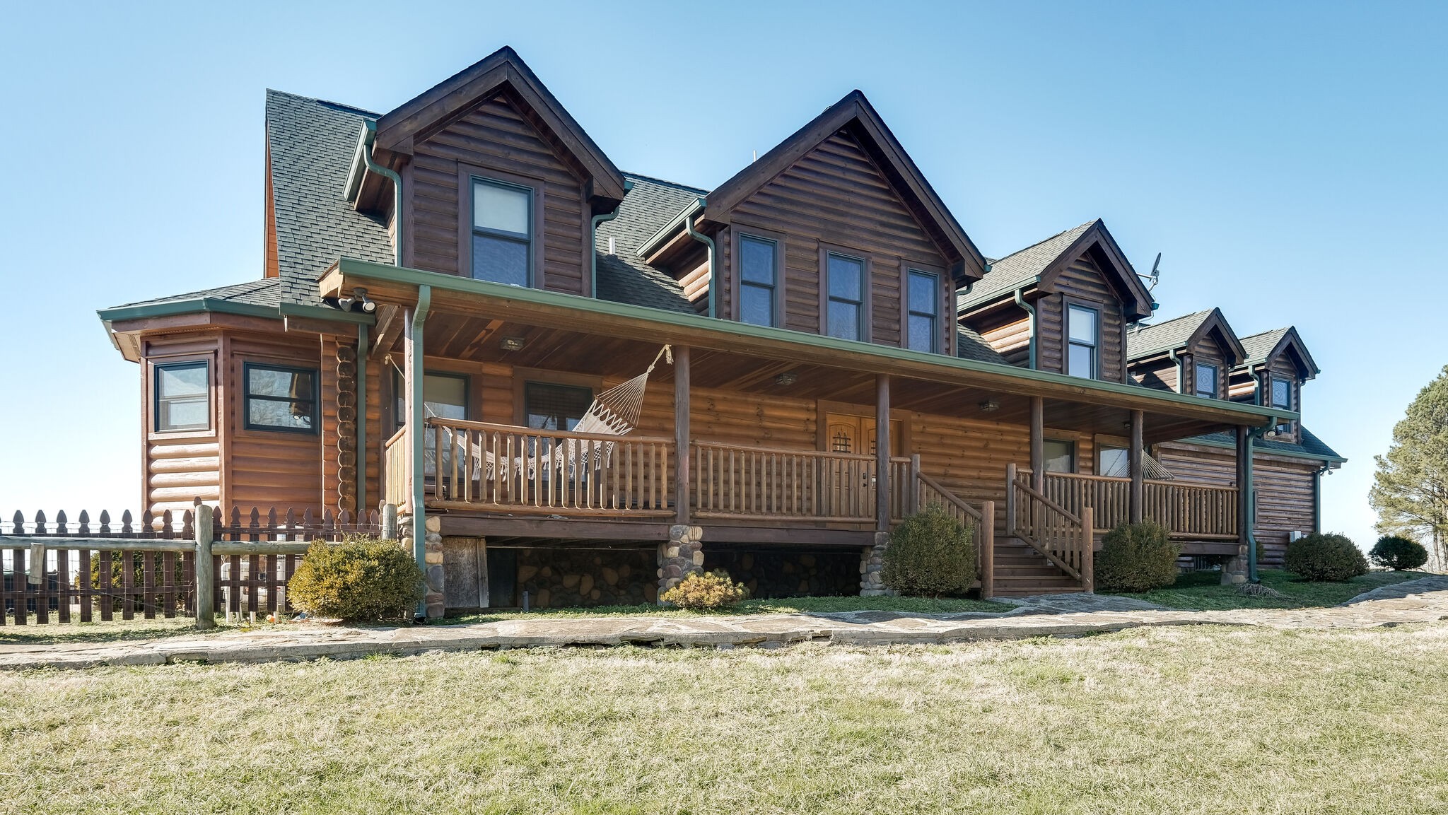 4054 Wilson Pike Franklin, TN 37067 - Photo 4 of 37 a front view of a house with a yard
