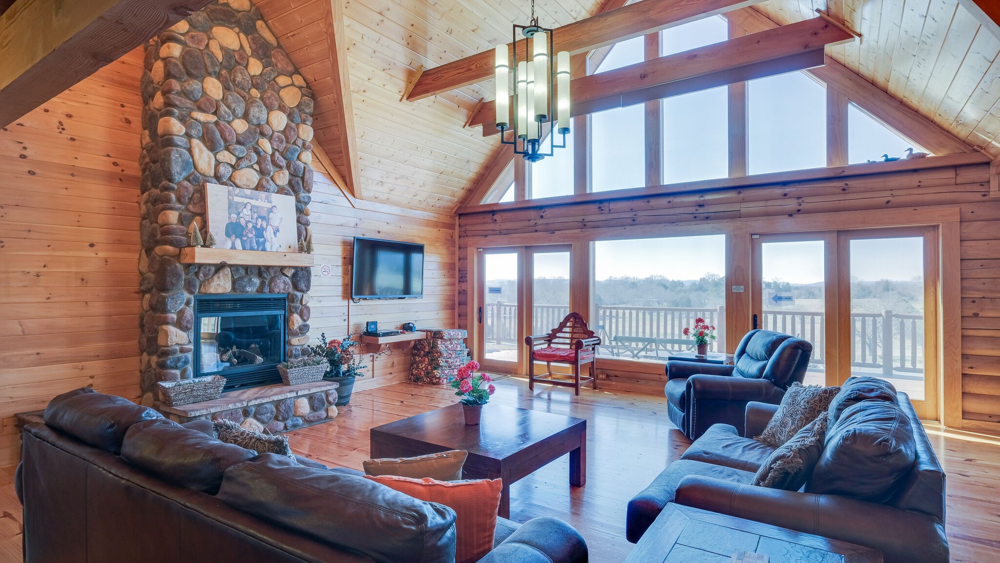 4054 Wilson Pike Franklin, TN 37067 - Photo 8 of 37 a living room with furniture a fireplace and a floor to ceiling window
