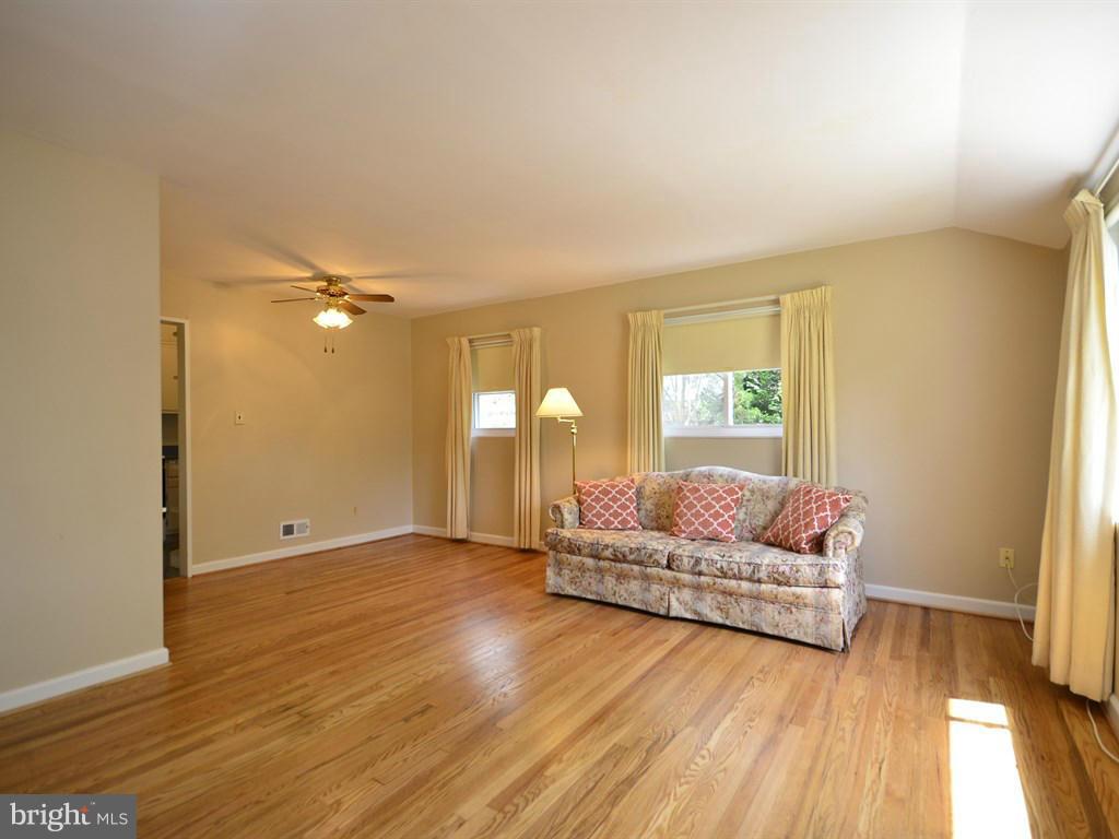 12833 Flack Street Silver Spring, MD 20906 - Photo 4 of 30 a living room with furniture and a wooden floor
