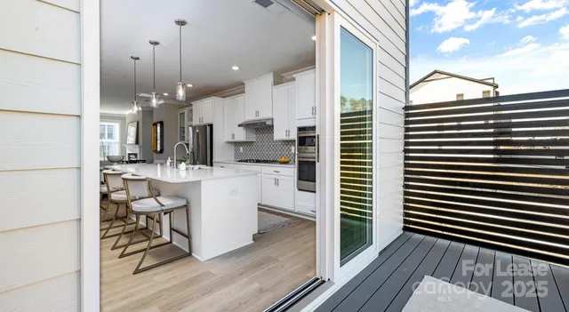 a open kitchen with a sink appliances and cabinets