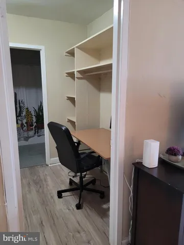 a kitchen with white cabinets appliances and a sink