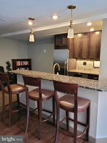 a kitchen with a table and chairs in it