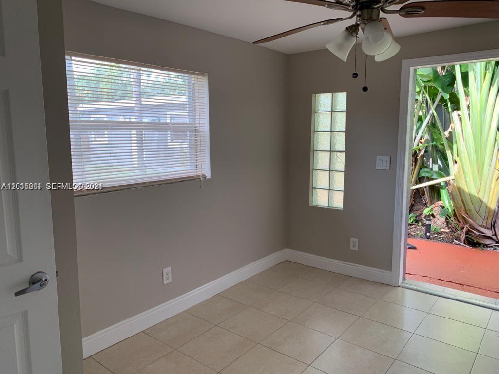 6012 Southwest 38th Street, Unit 4 Miramar, FL 33023 - Photo 3 of 7 a view of an empty room with a window
