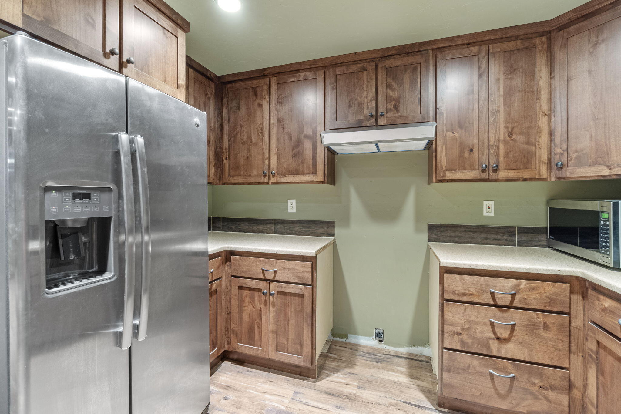 2630 Frontage Road Klamath Falls, OR 97601 - Photo 69 of 72 a kitchen with a refrigerator and cabinets