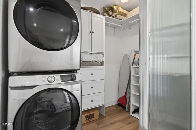 a bedroom with furniture and wooden floor