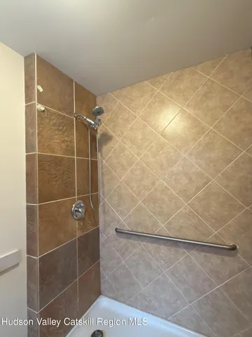 a bathroom with a sink a toilet and a window