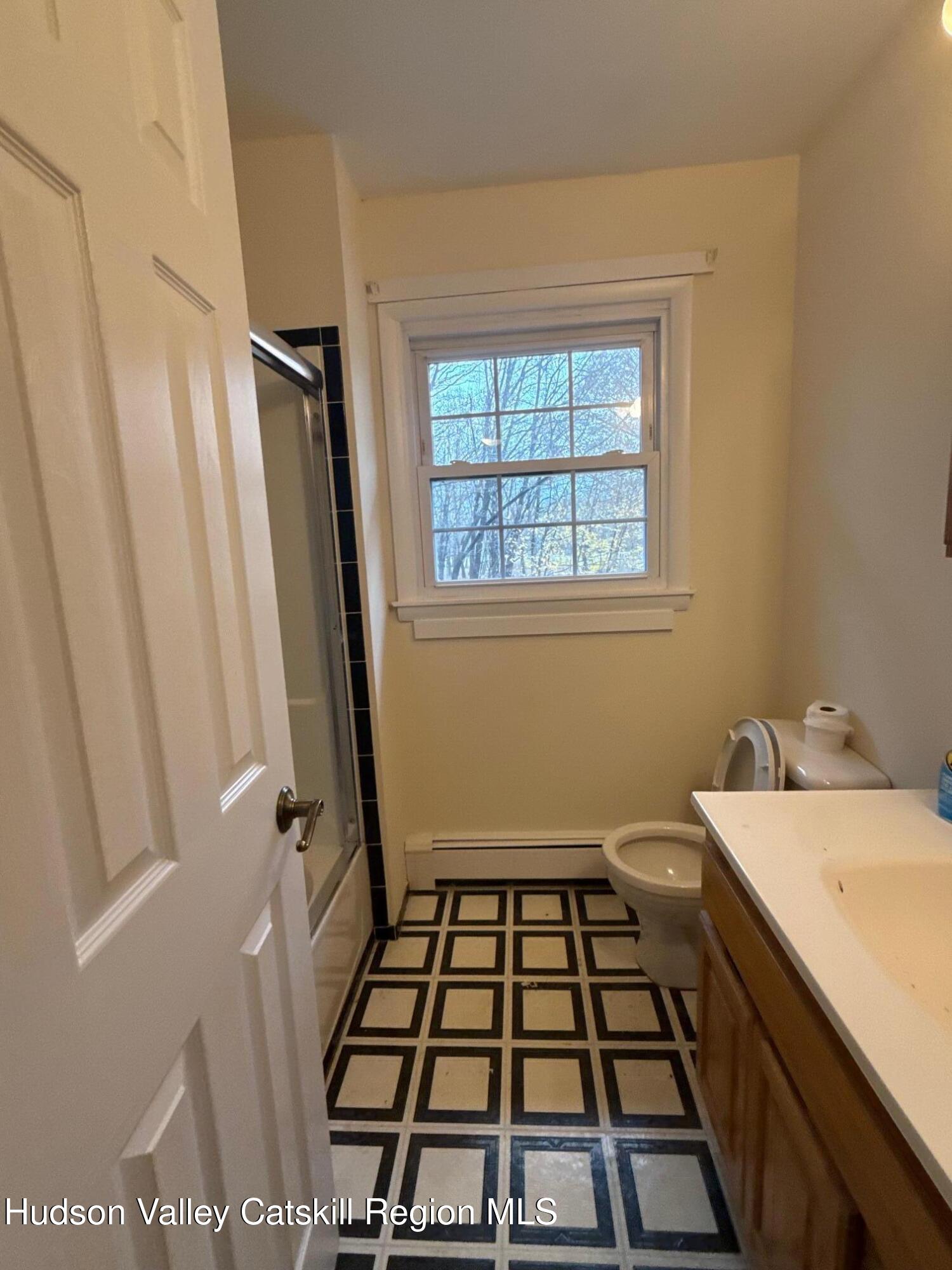 20 Van Orden Road Milton, NY 12547 - Photo 22 of 29 a bathroom with a sink a toilet and a window