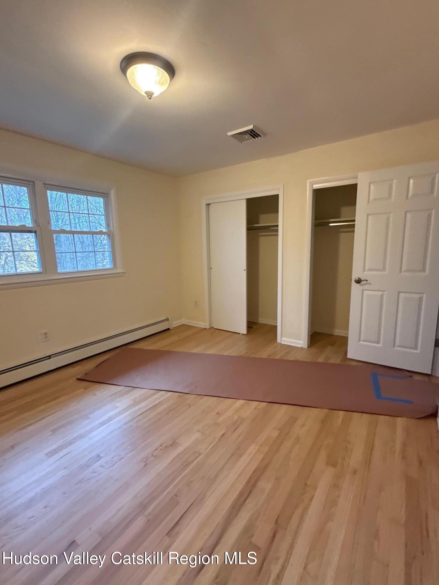 20 Van Orden Road Milton, NY 12547 - Photo 25 of 29 an empty room with wooden floor and windows