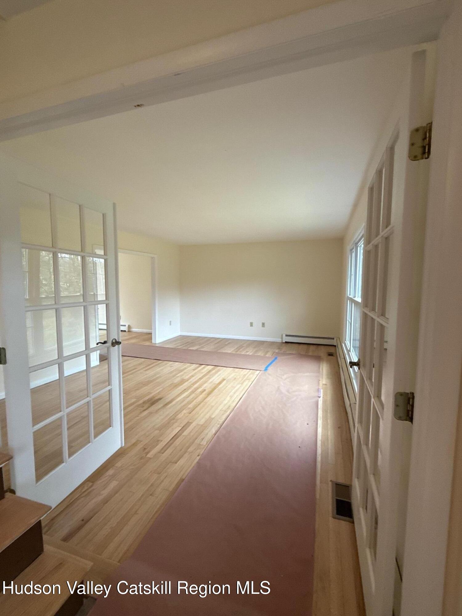 20 Van Orden Road Milton, NY 12547 - Photo 4 of 29 an empty room with wooden floor and windows
