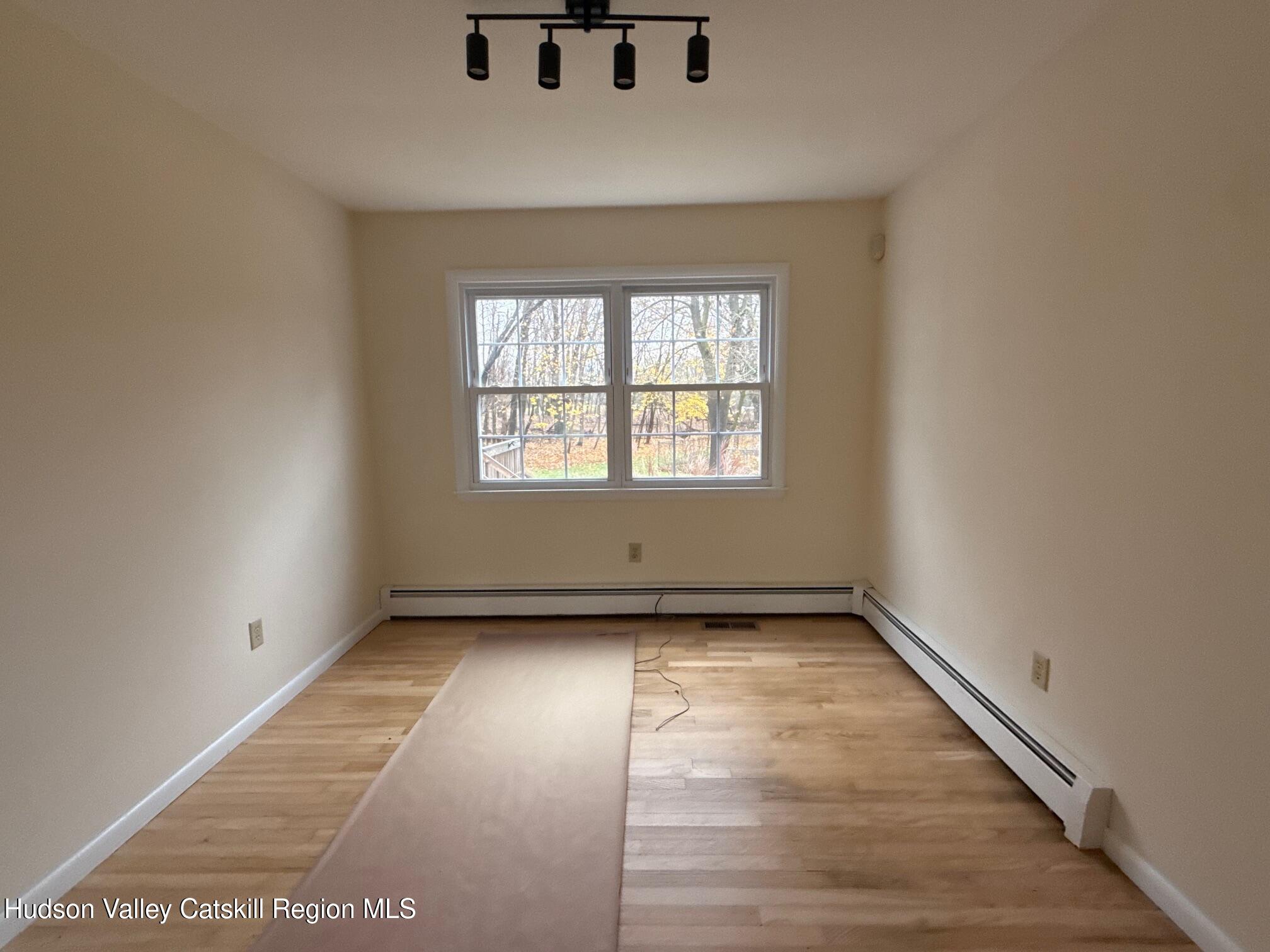 20 Van Orden Road Milton, NY 12547 - Photo 6 of 29 an empty room with wooden floor and windows