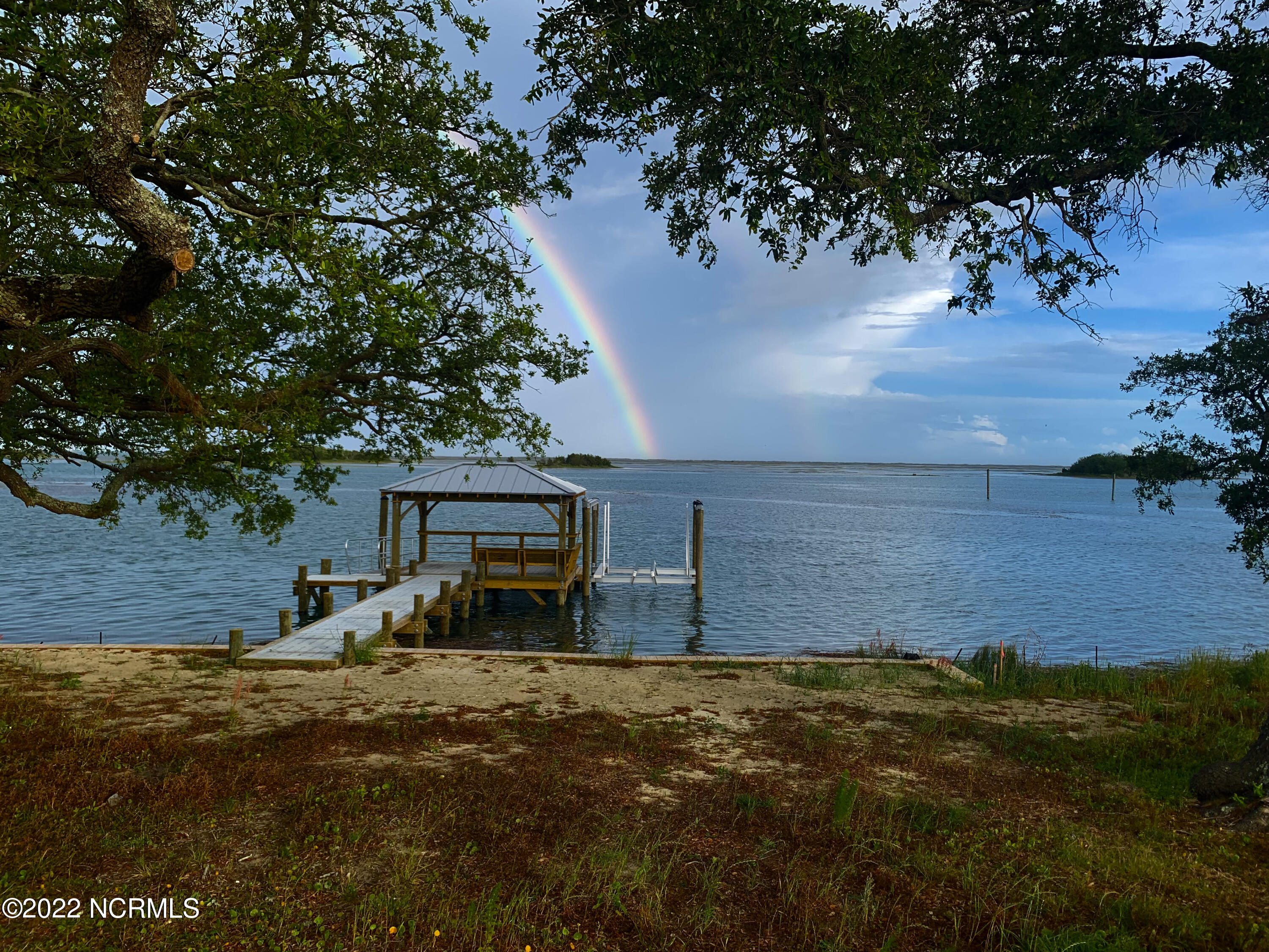 43 Waterfront Circle Hampstead, NC 28443 - Photo 6 of 9 Shot this rainbow, but part of neighbors dock is in pic