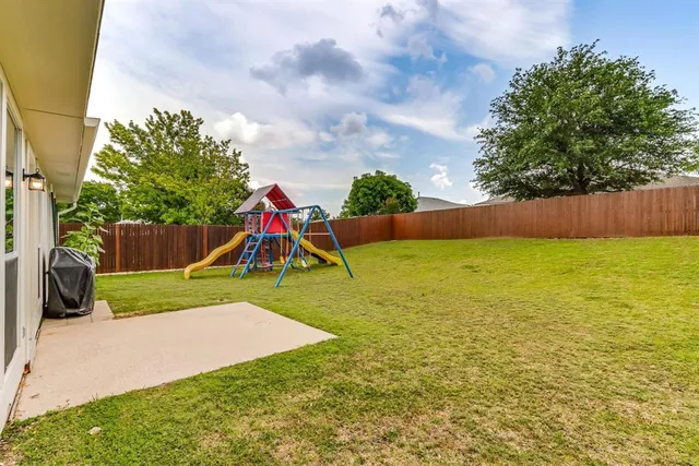 a view of a park with a slide