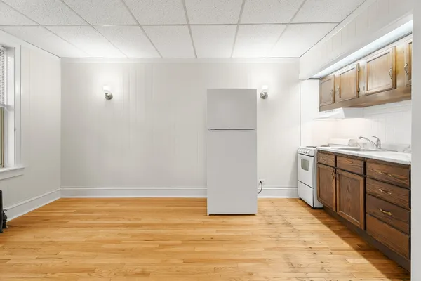a view of a kitchen with electric appliances