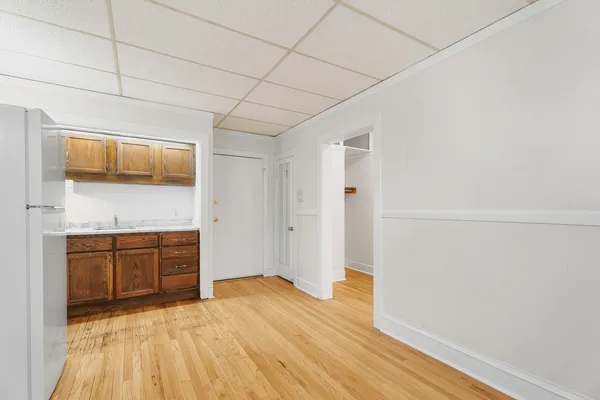 a room with a bed and cabinets