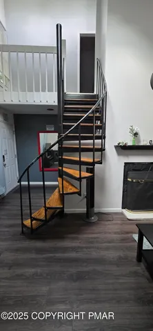 a view of entryway wooden floor and staircase