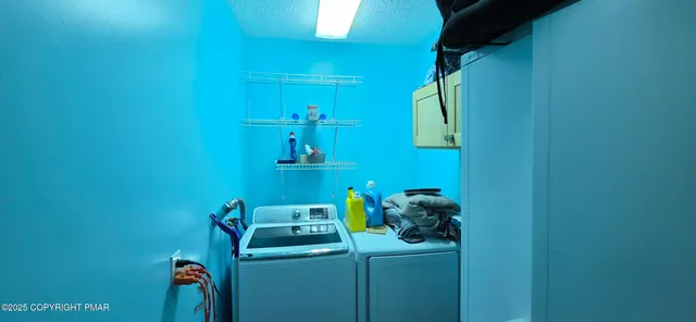 a view of balcony with couch and chairs