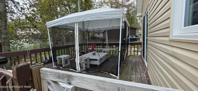 a view of balcony with furniture