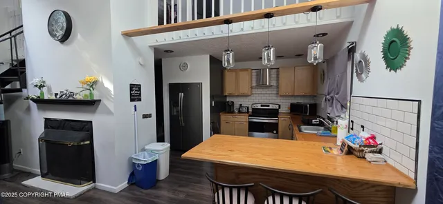a kitchen with a table and chairs