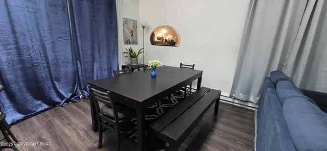 a view of a livingroom with furniture and wooden floor