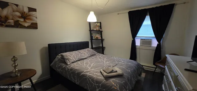 a bedroom with a bed and a closet