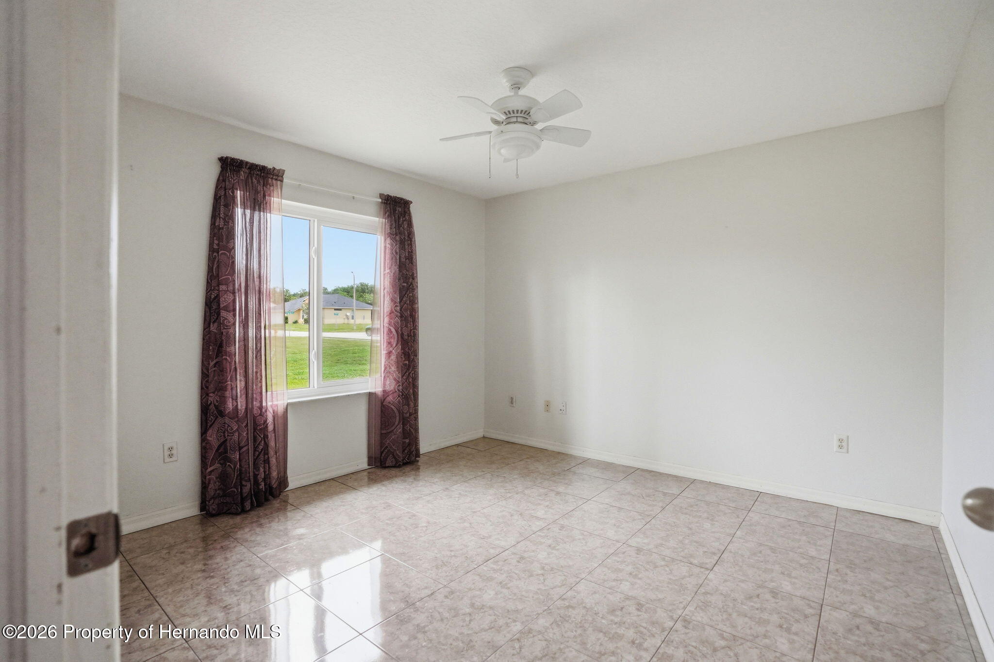 18131 Rivard Boulevard Brooksville, FL 34604 - Photo 32 of 66 an empty room with windows and closet