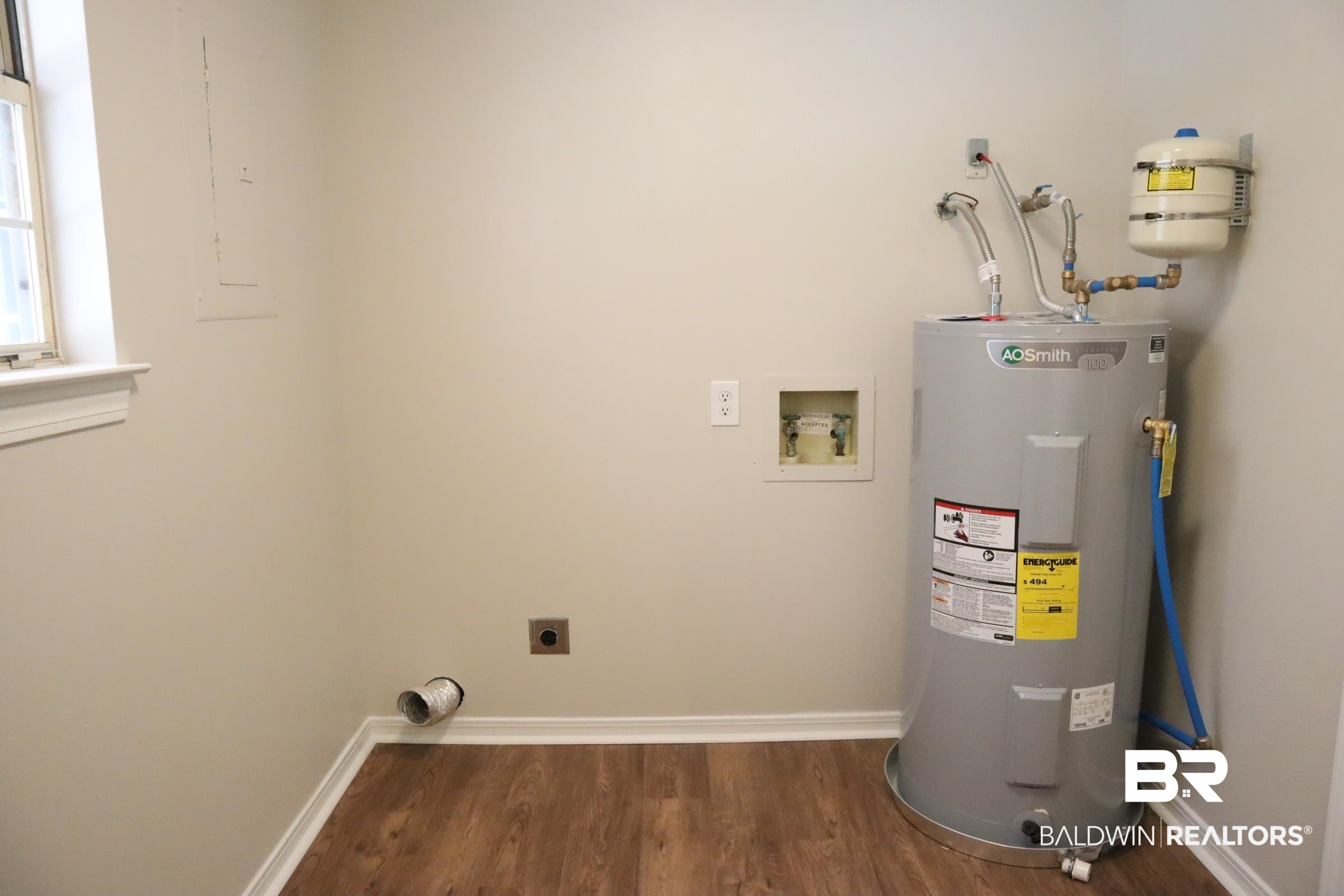 12150 Lee Bishop Road Irvington, AL 36544 - Photo 25 of 26 Utility room featuring water heater