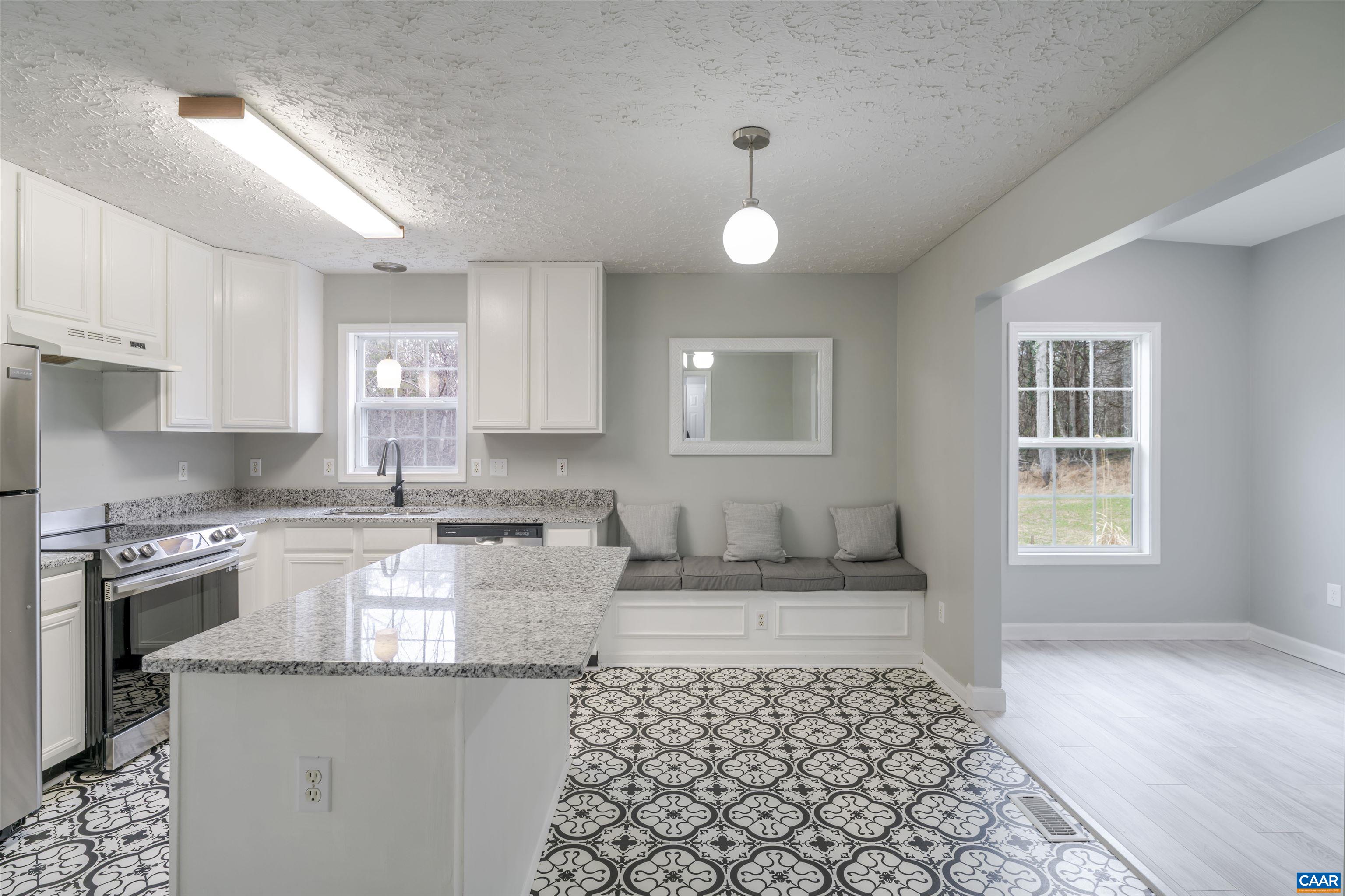 5860 Bearwood Road Crozet, VA 22932 - Photo 12 of 67 a kitchen with granite countertop a sink and cabinets