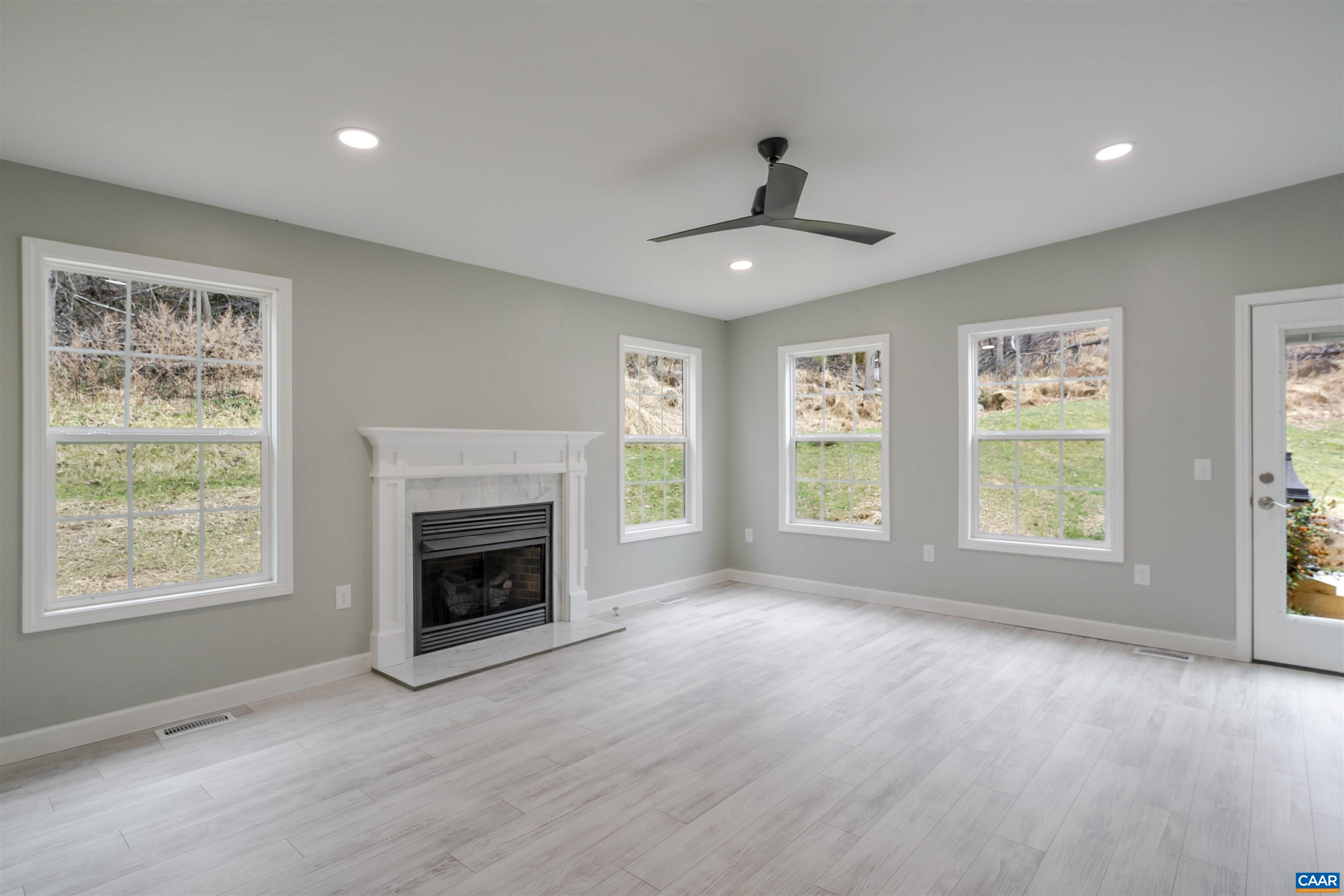 5860 Bearwood Road Crozet, VA 22932 - Photo 19 of 67 a view of an empty room with window and fire place