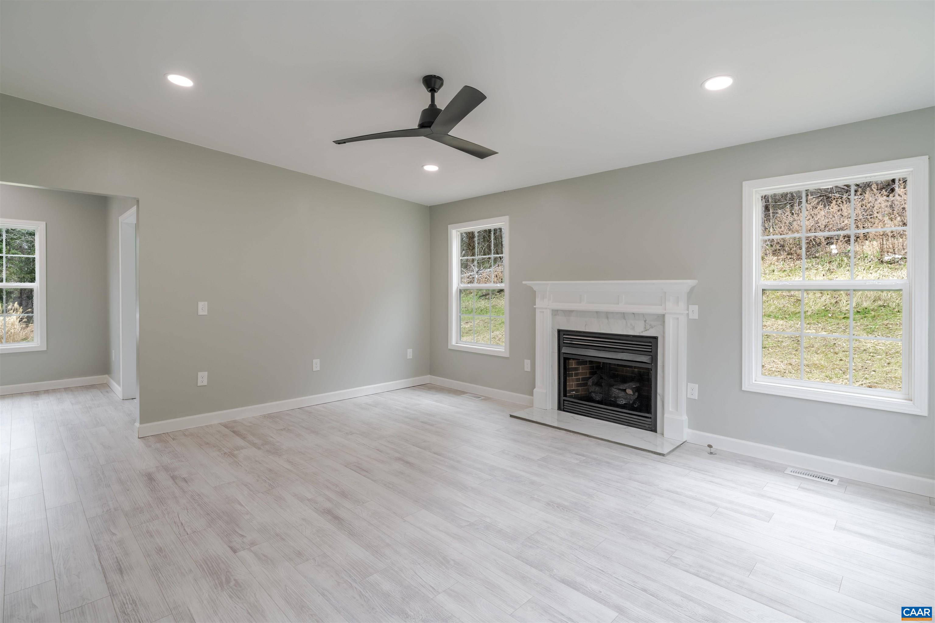 5860 Bearwood Road Crozet, VA 22932 - Photo 21 of 67 a view of an empty room with window and fire place