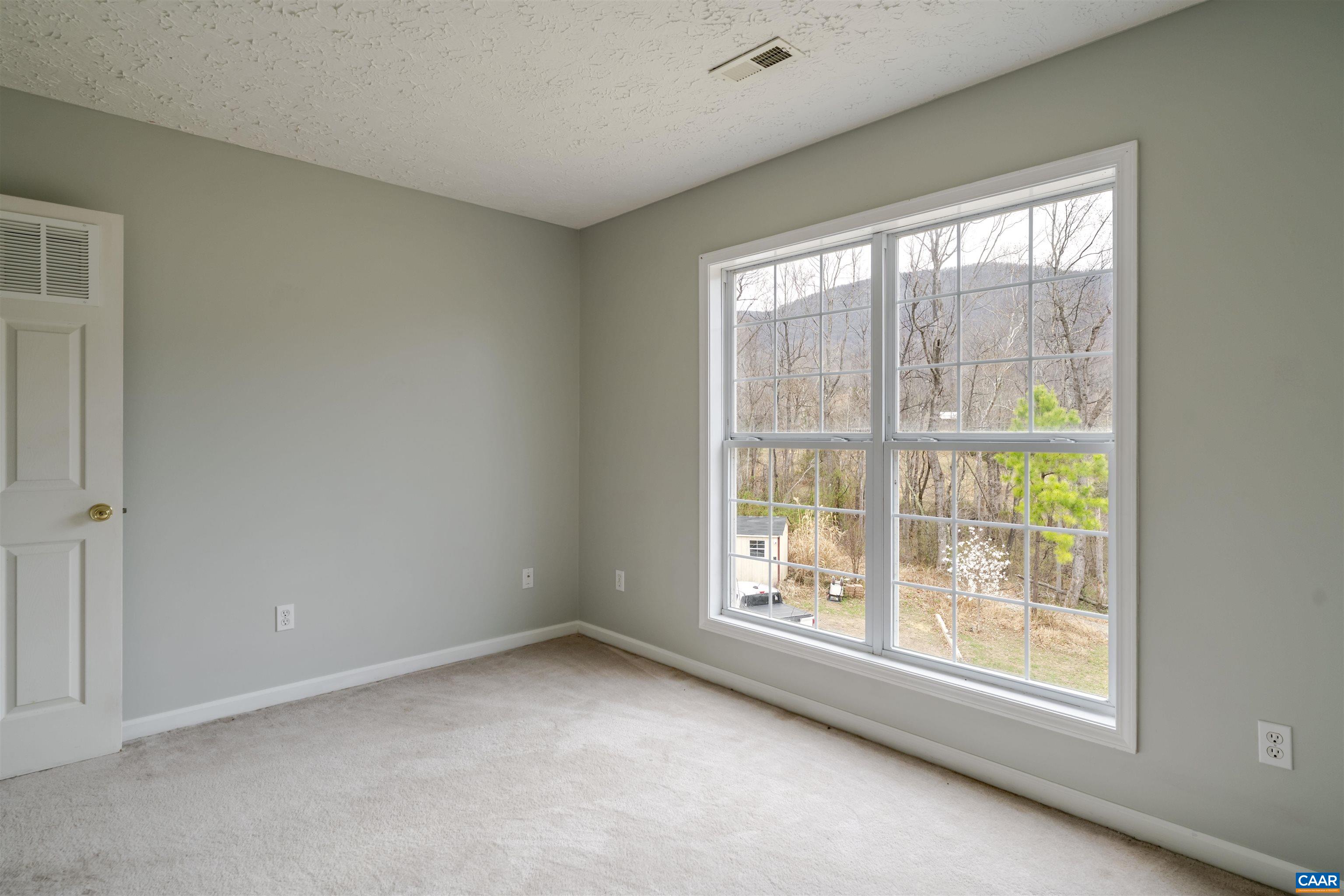 5860 Bearwood Road Crozet, VA 22932 - Photo 23 of 67 an empty room with windows