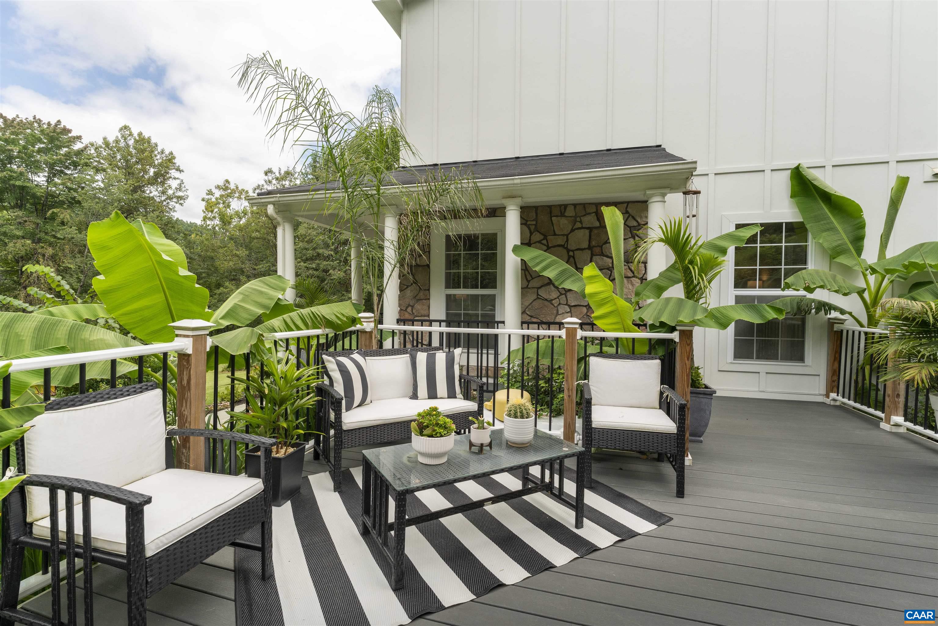 5860 Bearwood Road Crozet, VA 22932 - Photo 47 of 67 a view of a chairs and table in patio with a barbeque grill