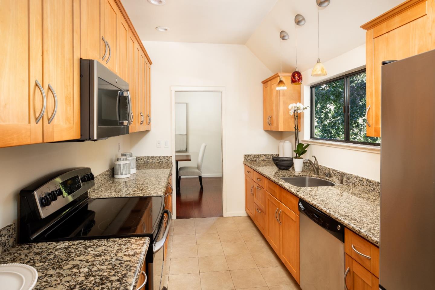 2 Farm Road Los Altos, CA 94024 - Photo 8 of 23 a kitchen with granite countertop stainless steel appliances a sink stove top oven and cabinets