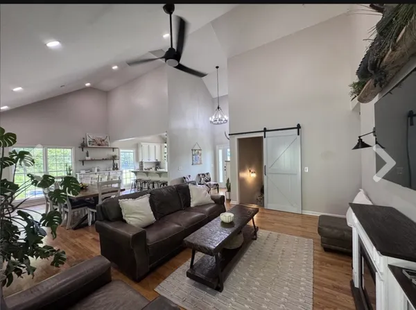 a kitchen with kitchen island granite countertop lots of counter top space and stainless steel appliances