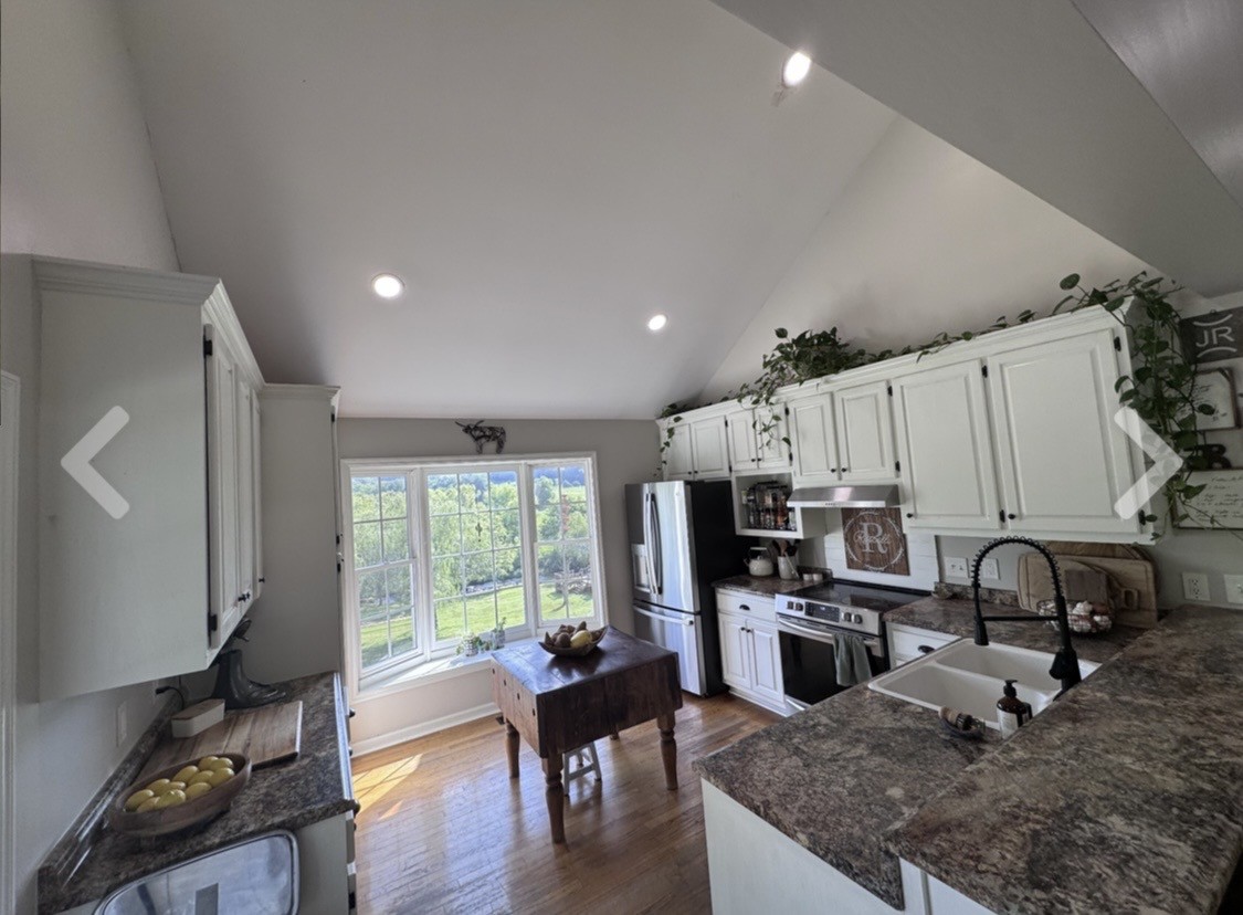 3310 Dog Branch Road Prospect, TN 38477 - Photo 21 of 49 a kitchen with sink a stove and cabinets