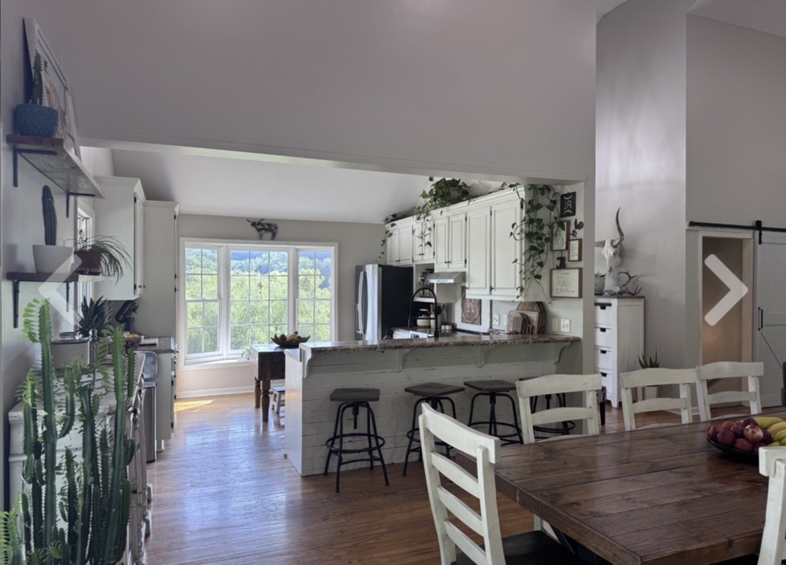 3310 Dog Branch Road Prospect, TN 38477 - Photo 23 of 49 a view of a dining room with furniture and wooden floor