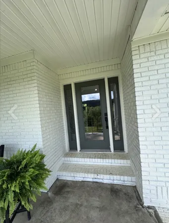 a view of entrance gate of a house