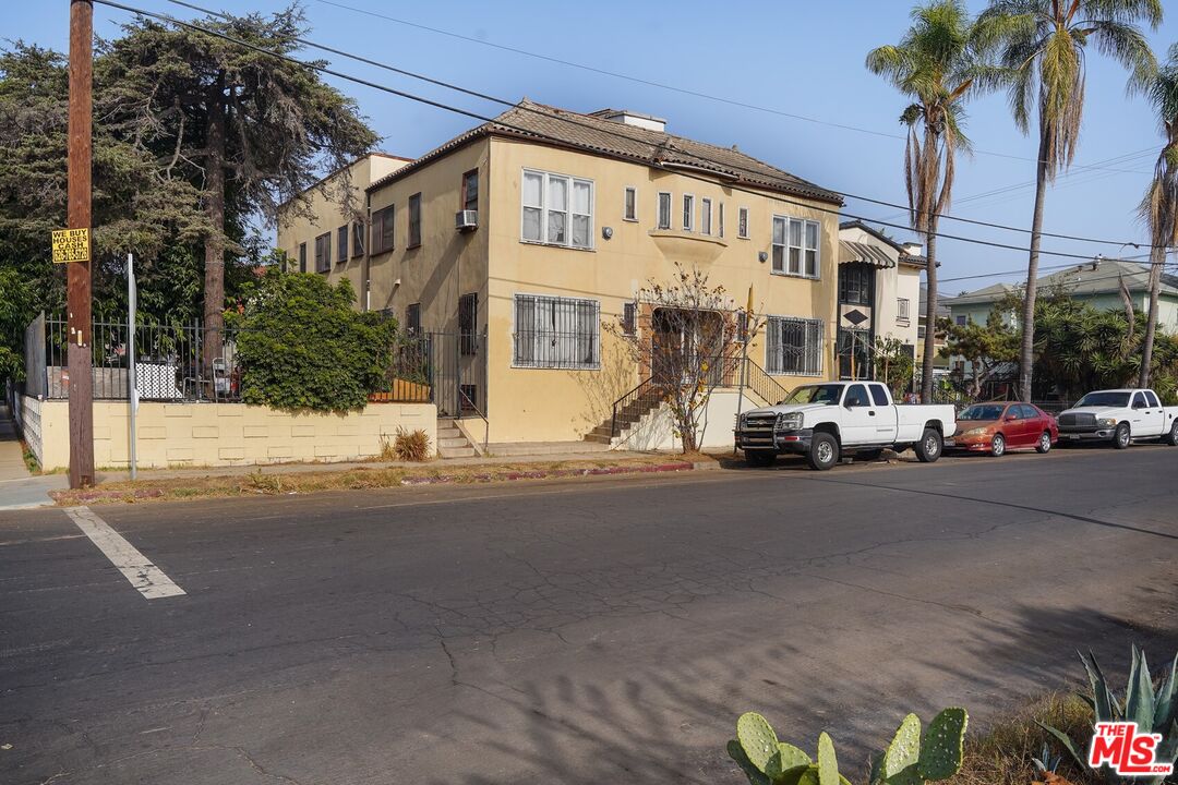 1519 West 30th Street Los Angeles, CA 90007 - Photo 2 of 8 a view of a street with cars