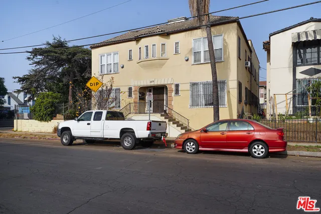 a view of a cars parked in front of a building