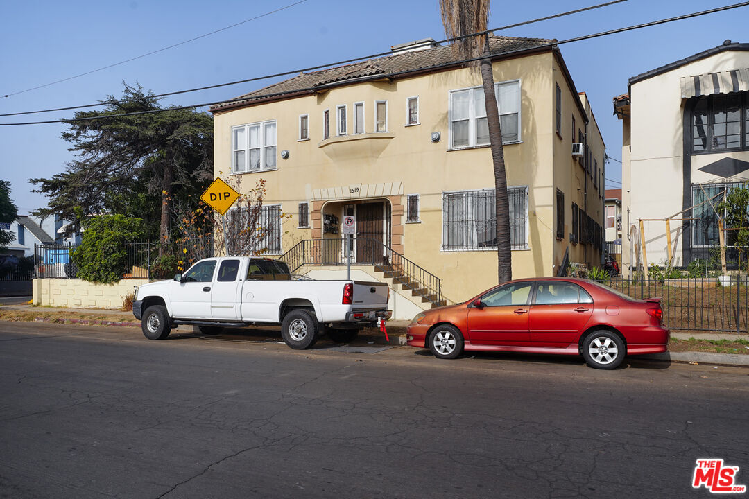 1519 West 30th Street Los Angeles, CA 90007 - Photo 3 of 8 a view of a cars parked in front of a building