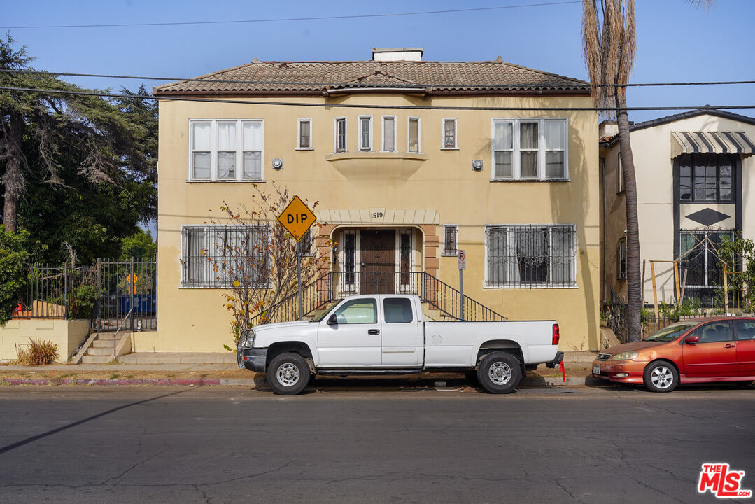 1519 West 30th Street Los Angeles, CA 90007 - Photo 7 of 8 a car parked in front of a house