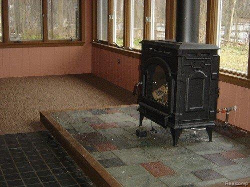 9250 Tower Road South Lyon, MI 48178 - Photo 3 of 13 Stove in bright, all-season room
