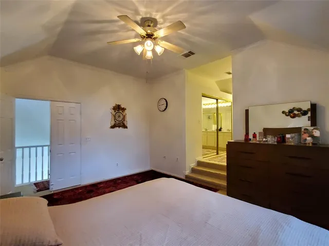 a spacious bathroom with a double vanity sink a mirror and a bathtub
