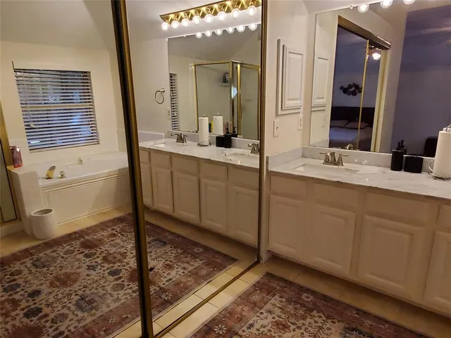 a bathroom with a bathtub and a sink