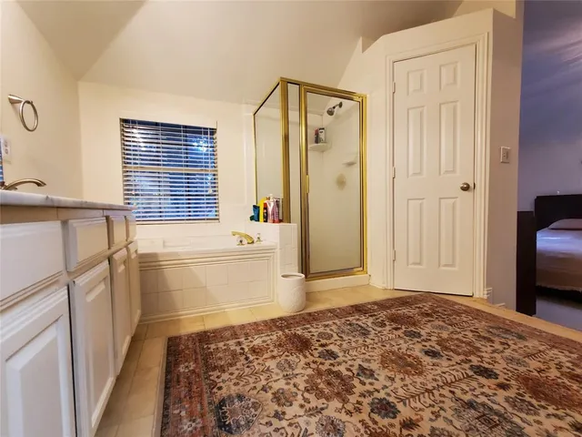 a bathroom with a sink a toilet and a tub